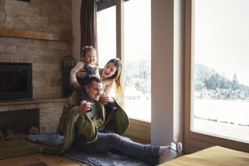 Young family relaxing in their home on a winter day