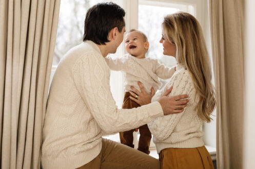 Young family enjoying a wintery day in their Shawnee home